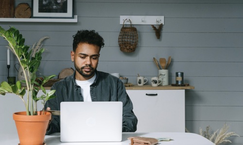 a man looking at a computer